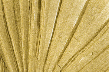 Detailed texture of glittering golden dust surface. Golden Shiny Wallpaper , Perfect for Christmas, New Year or any other Holidays Background. Golden fine powder