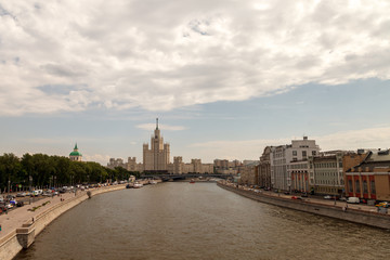 Fototapeta na wymiar View of the embankment of the Moscow river and the hotel Ukraine in Moscow. View from the observation bridge of Zaryadye Park