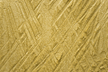 Detailed texture of glittering golden dust surface. Golden Shiny Wallpaper , Perfect for Christmas, New Year or any other Holidays Background. Golden fine powder
