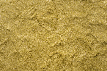 Detailed texture of glittering golden dust surface. Golden Shiny Wallpaper , Perfect for Christmas, New Year or any other Holidays Background. Golden fine powder