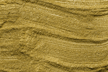 Detailed texture of glittering golden dust surface. Golden Shiny Wallpaper , Perfect for Christmas, New Year or any other Holidays Background. Golden fine powder