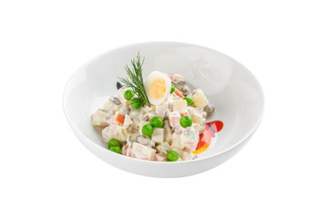Russian traditional salad Olivier with egg and green pea isolated on white background