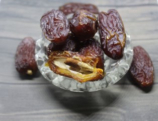 Sweet medjool dates with cup for ramadan kareem