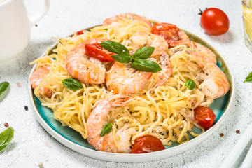 Pasta seafood with shrimp on white table.