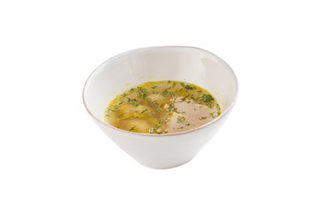 chicken broth with meatballs and herbs in bowl isolated on white background