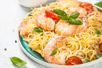 Pasta seafood with shrimp on white table.