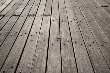 Wooden Floor Board Deck Background. Old gray wooden planks with iron forged rivets. Perfect...
