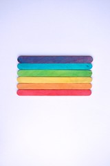lgbt flag with wooden chopsticks, colorful background