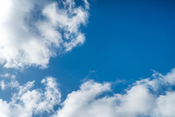 Background nature clear clean blue sky soft clouds beautiful dramatic cloudscape summer sun ray light presents beautiful day life after storm. use as overlay effect or frame with center copy space  