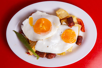 Fried eggs with chorizo