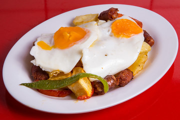 Fried eggs with chorizo