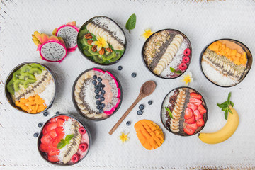 Vegan smoothie bowls with fruits and seeds