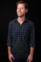 Obraz premium Portrait of happy bearded hipster man thinking