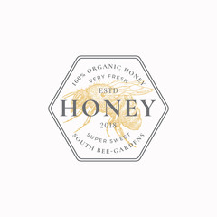 Natural Honey Badge or Logo Template. Hand Drawn Bee Sketch with Retro Typography and Borders. Vintage Premium Emblem in a Comb Shaped Frame.