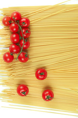 
close-up of spaghetti and cherry tomatoes on a white background