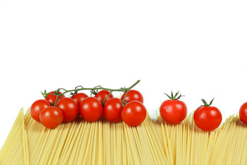
typical ingredients of Italian cuisine: spaghetti and cherry tomatoes