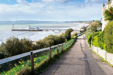 Obraz premium Bournemouth pier, Dorset, England, view of the blue sea and the road to the beach, selective focus