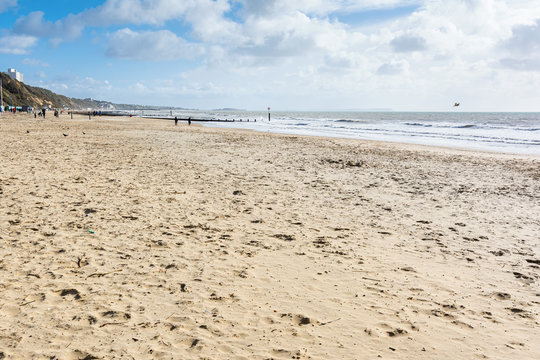 Sandy Bournemount beach in spring, view of the blue sea, selective focus