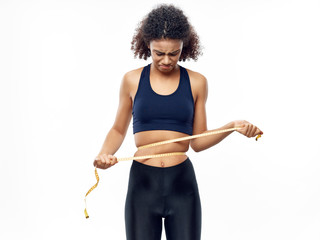 woman measuring waist