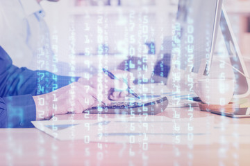 Double exposure of data internet theme hologram with man working on computer on background. Concept of innovation.