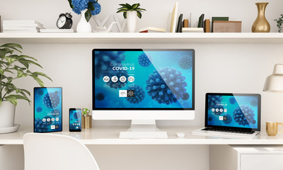 home office setup with responsive devices showing coronavirus info