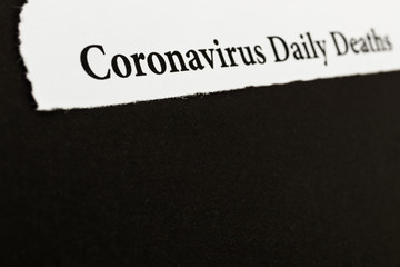 Coronavirus breaking news headline clipping from newspaper.