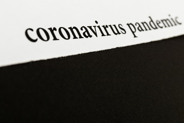 Coronavirus breaking news headline clipping from newspaper.