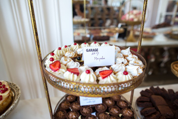 Delicious candy bar with macaroons, cakepops, cupcakes and other sweets