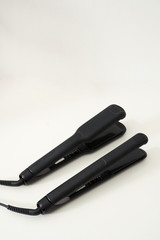 hair irons on a white background