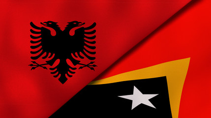 The flags of Albania and East Timor. News, reportage, business background. 3d illustration