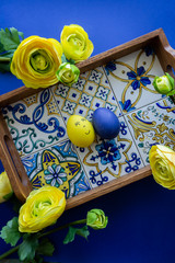 Happy Easter Day Around Yellow Flowers With Blue Egg On a Blue Background