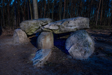 Prehistoric megalith dolmen Teufelskueche (devils kitchen) at night