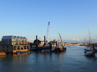Industrial ship in the canal at the quay © Rafal