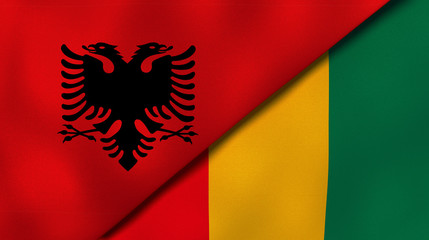Fototapeta premium The flags of Albania and Guinea. News, reportage, business background. 3d illustration