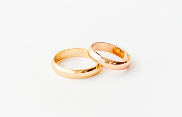 two rose gold wedding rings isolated on white, wedding rings concept. 