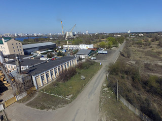Fototapeta na wymiar Aerial view of industrial area inKiev at spring (drone image).