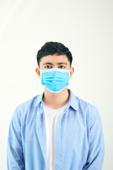 COVID-19 symptom Pandemic Coronavirus Man wearing face mask protective for spreading of disease New species. Man with surgical mask on face against Coronavirus Disease 2020.