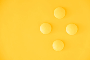 Yellow balls on yellow background. Minimal concept. Top view. Copy, empty space for text