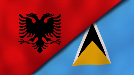 The flags of Albania and Saint Lucia. News, reportage, business background. 3d illustration