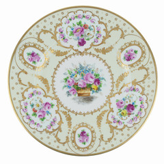 antique gold plate with flowers isolated on white background
