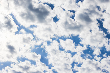 many white clouds in the blue dramatic sky