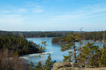 Beautiful landscape with icy lake in the national park Repovesi, Finland