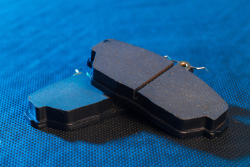 brake pads on dark background close up view