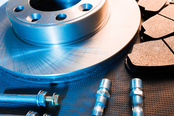 brake parts on dark background  brake pads, disc, brake hose, guides, cylinders - Image