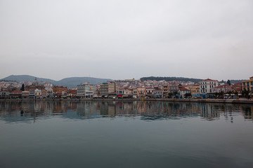 foggy winter landscape of port city in greece