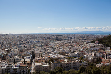 Fototapeta premium skyline of the city of Athens from the top of a hill with the sea in the background
