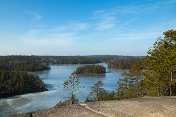 Beautiful landscape with icy lake in the national park Repovesi, Finland