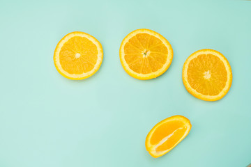 Fototapeta premium sliced orange on a bright green background