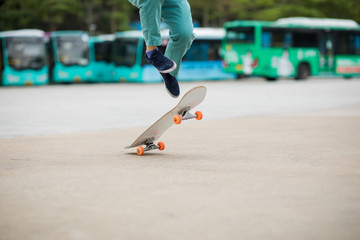 Skateboarder legs skateboarding at outdoors
