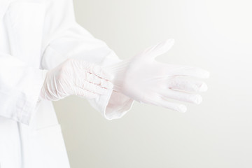 Doctor with white gloves